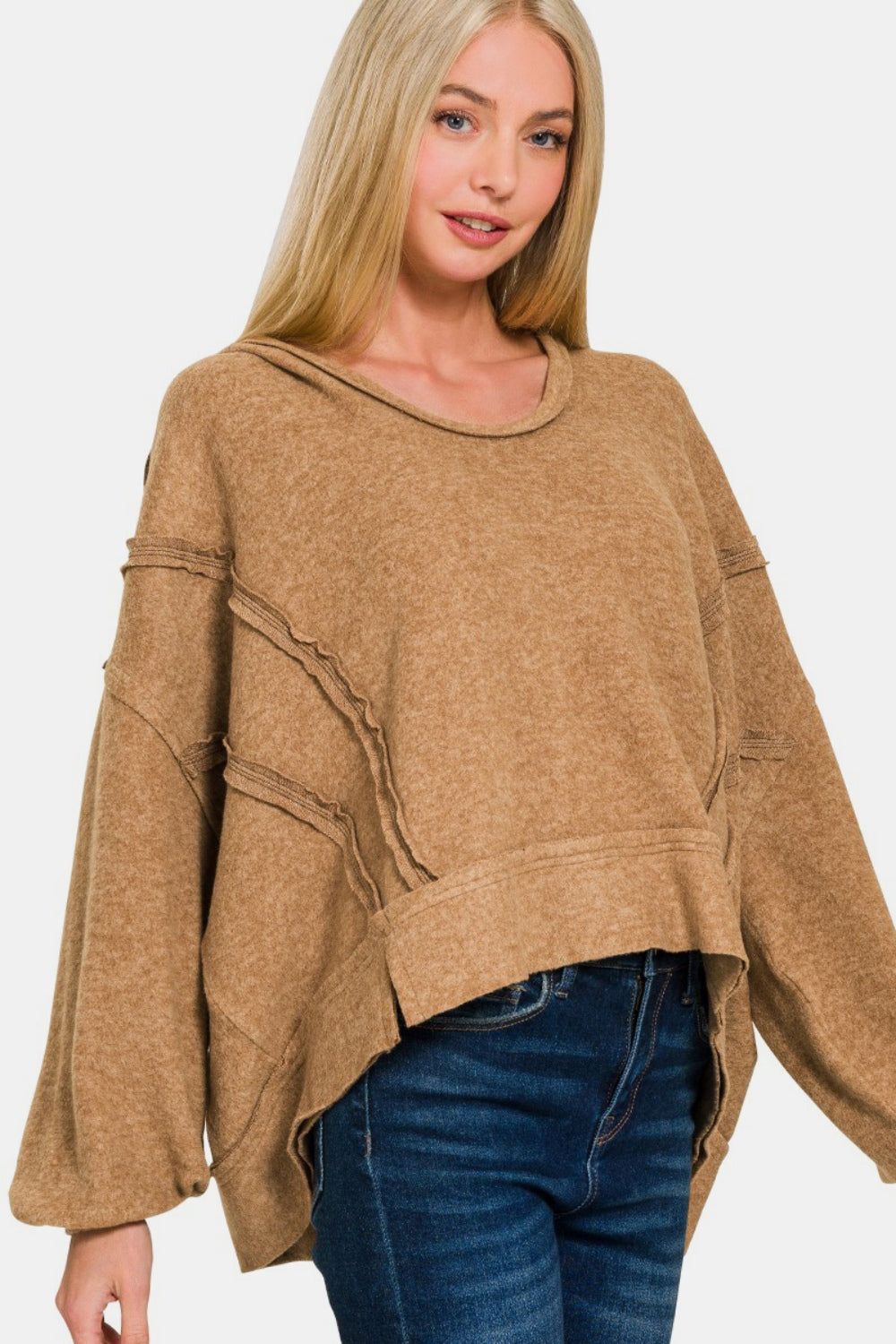 Exposed seam hoodie with balloon sleeves in brown Hacci material.
