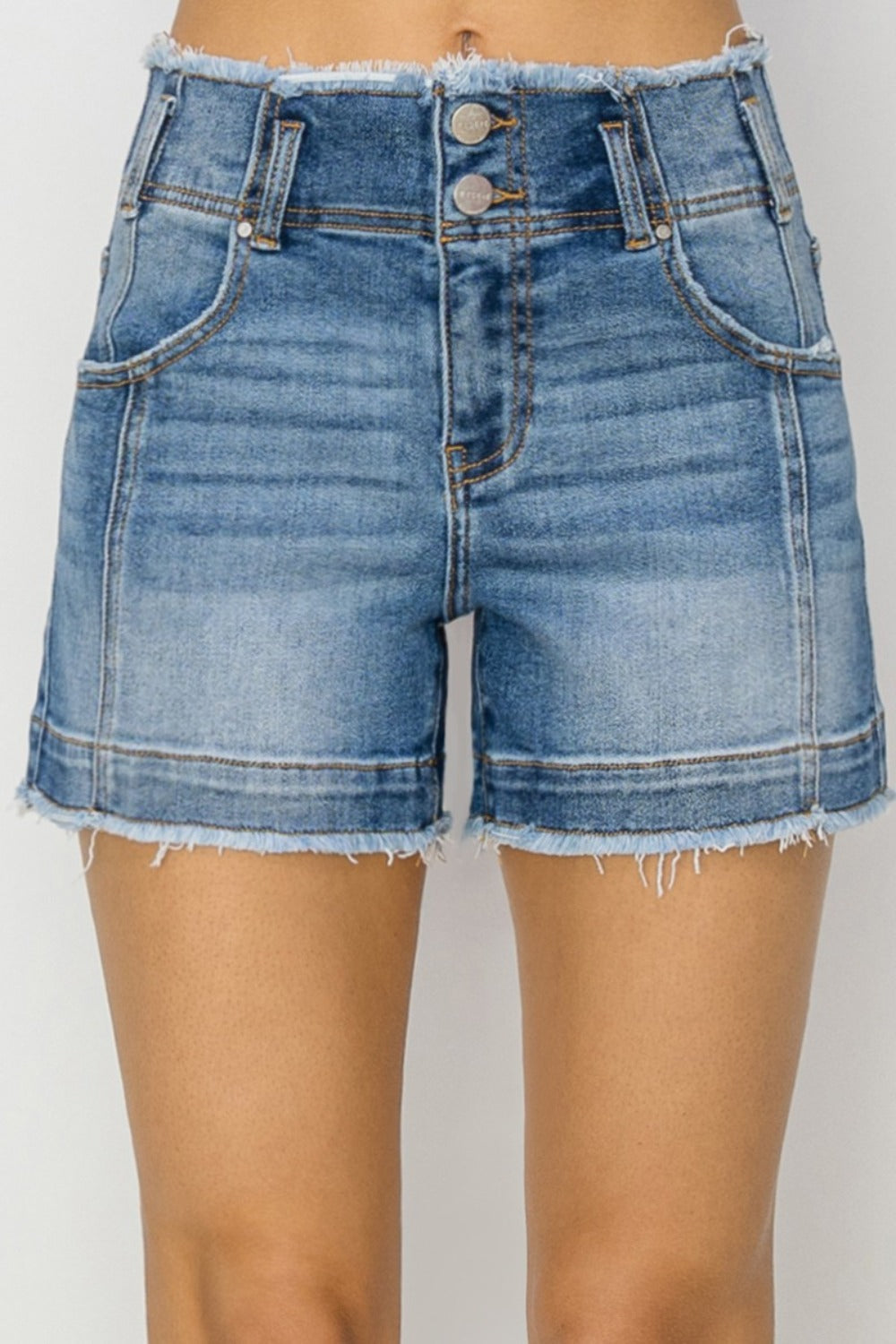 High rise seam detail denim shorts with raw edge hem.