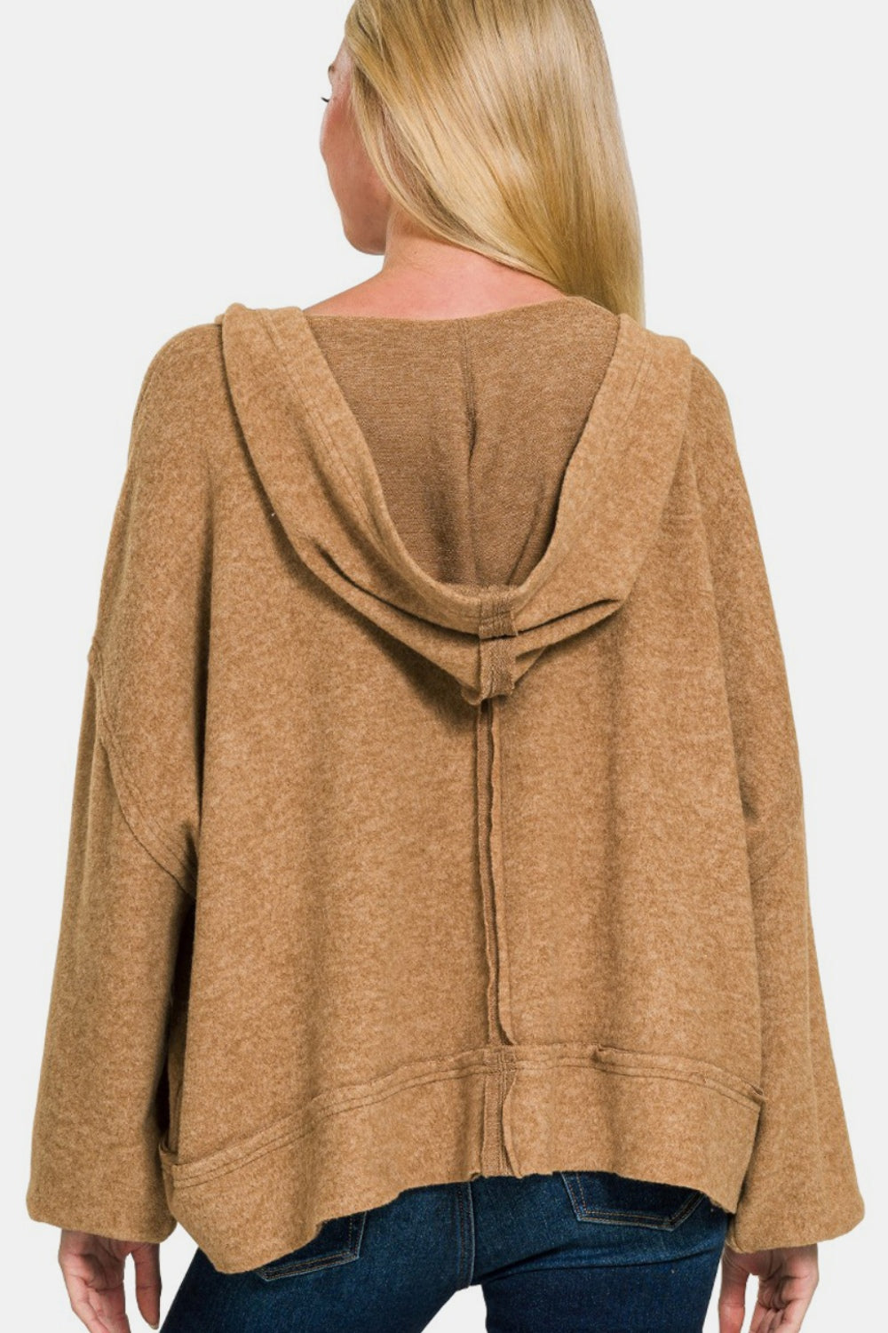 Exposed seam hoodie with balloon sleeves and high-low hem in soft Hacci material.