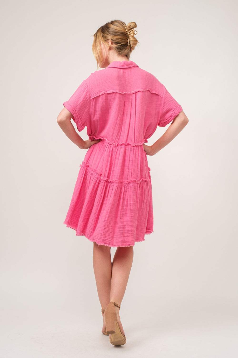 Raw edge tiered shirt dress in pink with a stylish, washed finish and an edgy, layered design.