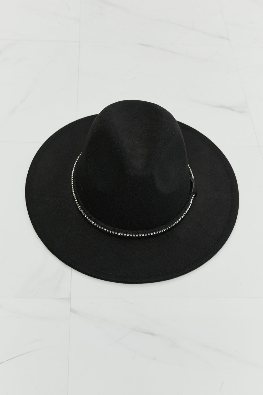 Black fedora hat with wide brim and rhinestone detailing for sophistication.