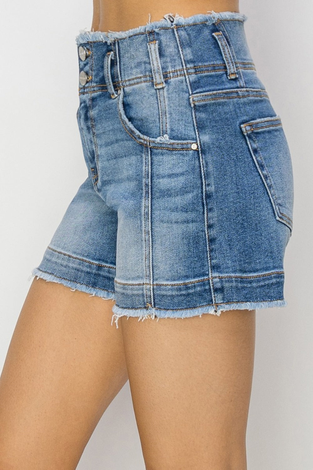 High rise seam detail denim shorts with raw edge.