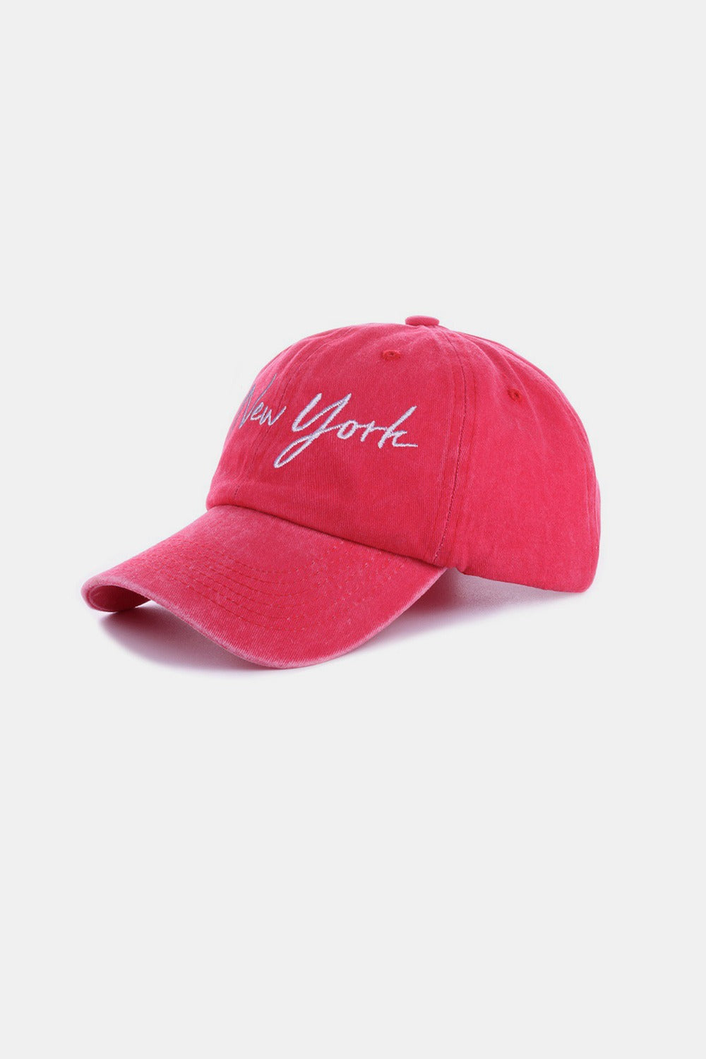 Red embroidered city cap with "New York" text, made from washed cotton, adjustable for everyday wear.