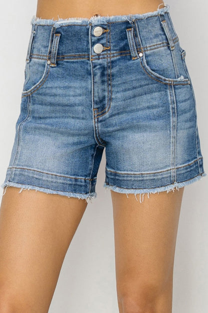 High rise seam detail denim shorts with raw edges and pockets.