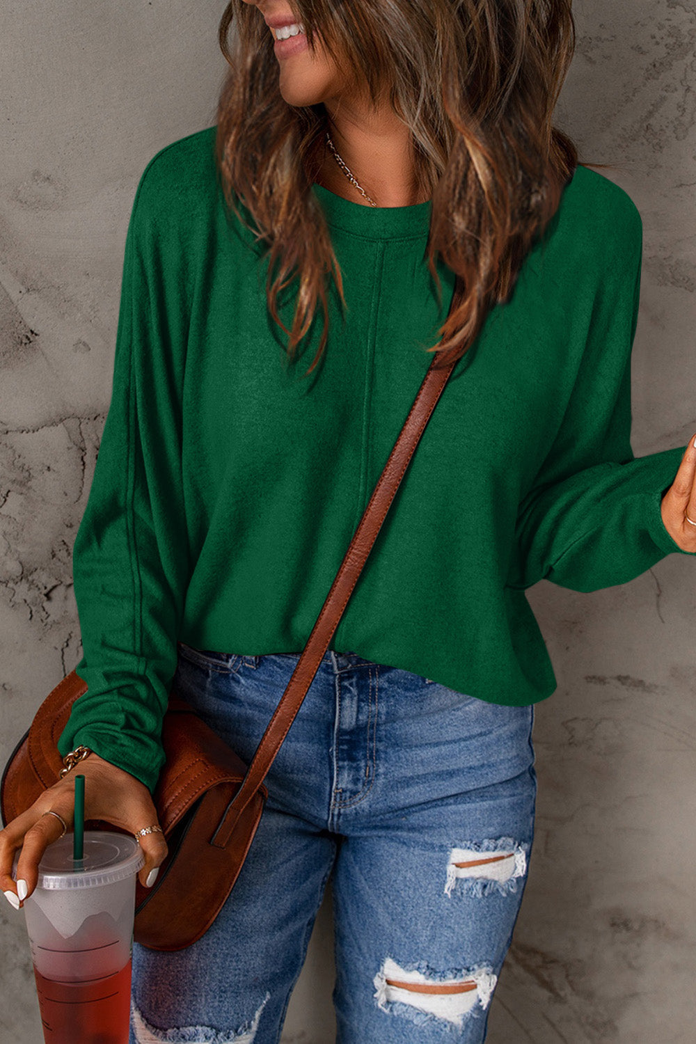 Round neck long sleeve tee in green with casual fit.